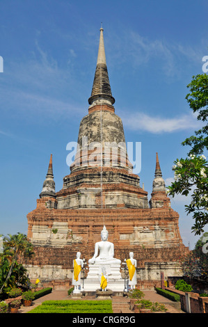 buddha statues in front of teh Great Chedi Chaya Mongkol, Thailand, Ayutthaya, Wat Yai Chai Mongkon Stock Photo