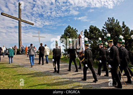 pit men in traditional clothing at stockpile Haniel on a crossroad, Germany, North Rhine-Westphalia, Bottrop Stock Photo