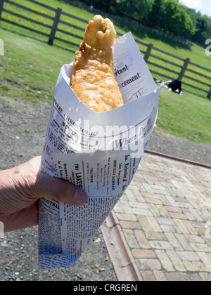 Fish and chips cooked in lard and served in a paper cone in Davy's Fish and Chip shop at Beamish Museum of Northern Life Stock Photo