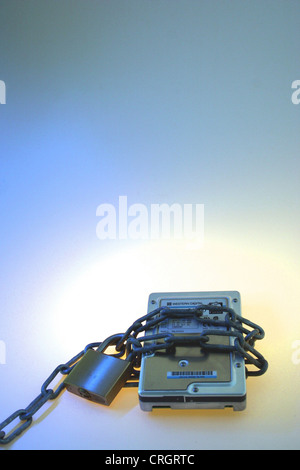 computer safety: chain with lock at harddisk Stock Photo