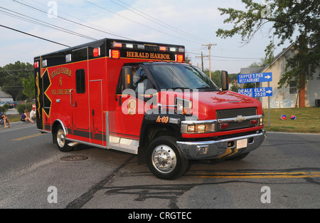 Ambulance from Herald Harbor Volunteer Fire Department responding on a call in Deale, Maryland Stock Photo