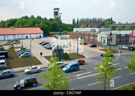 new commercial area in Bochum-Wattenscheid with the shaft tower of the former coal mine Holland in the background, Germany, North Rhine-Westphalia, Ruhr Area, Bochum Stock Photo