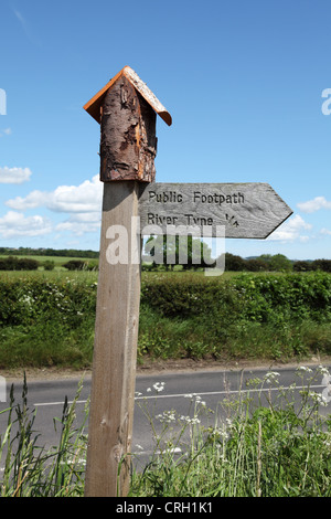 Unusual wooden footpath sign near to Ovingham north east England UK Stock Photo