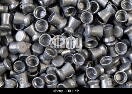 Pile of lead air-gun pellets close-up background texture Stock Photo