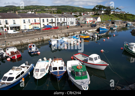 small harbour at the coastal fishing village of Carnlough on the antrim coast road northern ireland uk Stock Photo