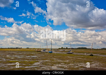 Boats at low tide in Chichester Harbour at Bosham, West Sussex, England Stock Photo
