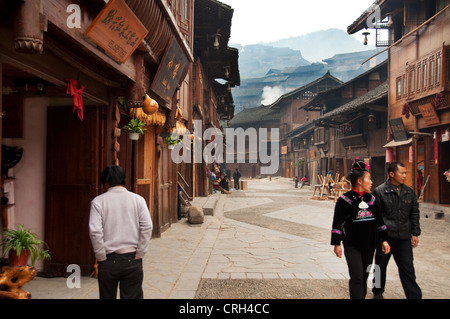 Pedestrians in the main street, Xijiang Miao village, China Stock Photo