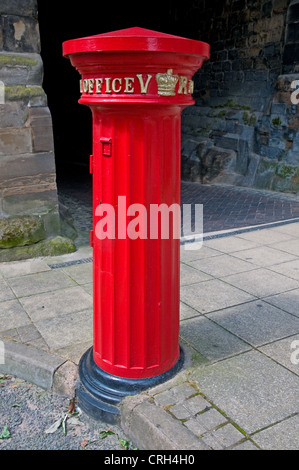 Red Victorian Post Pillar Letter Box cast in 1856 and one of the earliest in England at West Gate Warwick Warwickshire England Stock Photo