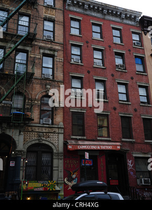 Grey sky portrait brick tenements 94 and 96 St.Mark's Place (Physical Graffiti and Fun City Tattoo),  East Village, New York Stock Photo