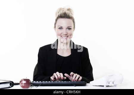 businesswoman working very hard at hes desk Stock Photo