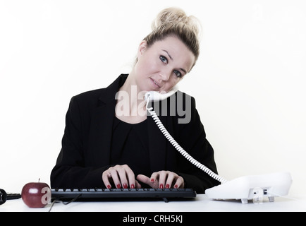 businesswoman working very hard at hes desk Stock Photo