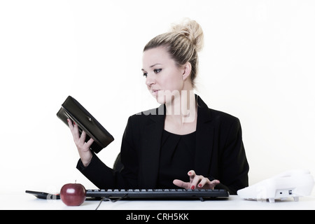 businesswoman working very hard at hes desk Stock Photo