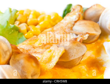 Egg omelet with vegetables and roasted pelmeni (meat dumplings). Modern daily Russian cuisine Stock Photo