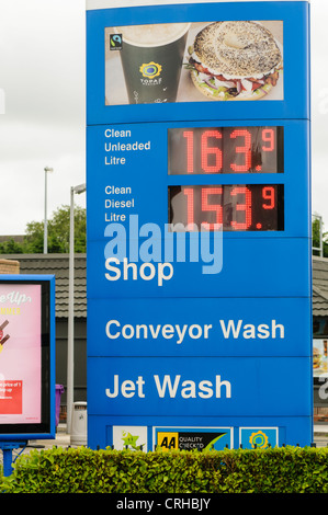 Sign on a petrol station showing unleaded petrol on sale for 163.9 and diesel at 153.9 Stock Photo