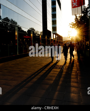 People Walking With Shadows Stock Photo - Alamy