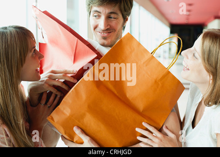 Man holding shopping bags for friends Stock Photo