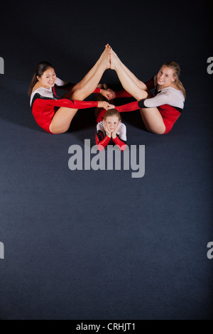 Female gymnasts performing floor routine Stock Photo