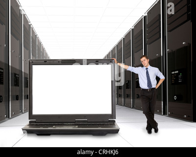 business servers in diminishing perspective and their manager with his laptop in front Stock Photo