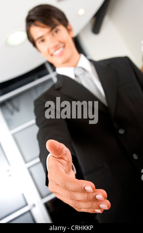 business man extending his hand Stock Photo