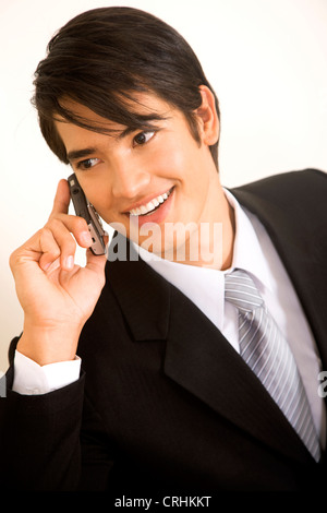 business man smiling and talking on a mobile phone Stock Photo