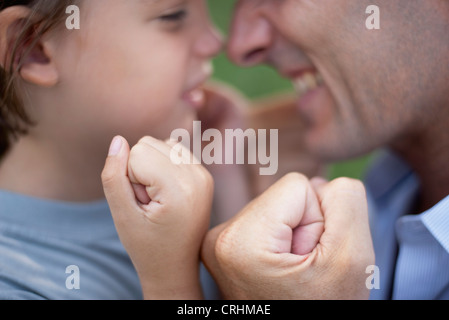 Father and son with fists clenched Stock Photo