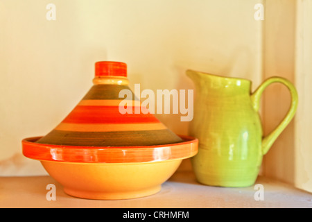 middle eastern cooking untensil, a tangine and water pitcher on display in an English cottage Stock Photo