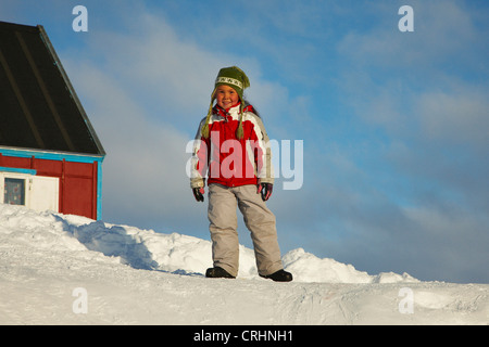 girl with , Greenland, Ostgroenland, Tunu, Kalaallit Nunaat, Scoresbysund, Kangertittivag, Ittoqqortoormiit Stock Photo