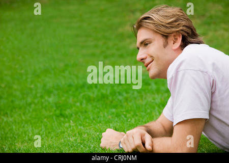 Casual man lying on the floor Stock Photo