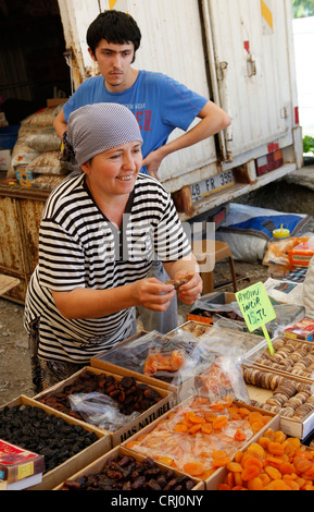 A market trader in southern Turkey selling dried fruit + nuts Stock Photo