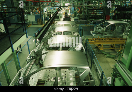 Car bodies on an assembly line Stock Photo