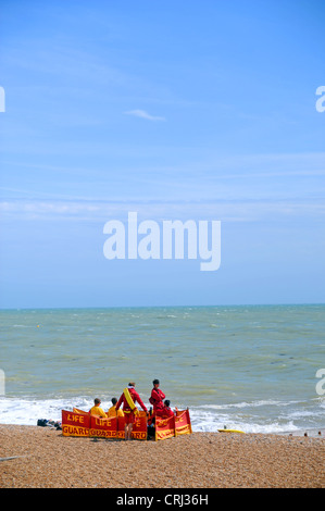 Lifeguards on Brighton beach with blue sky on a windy day too rough to swim in the sea UK Stock Photo
