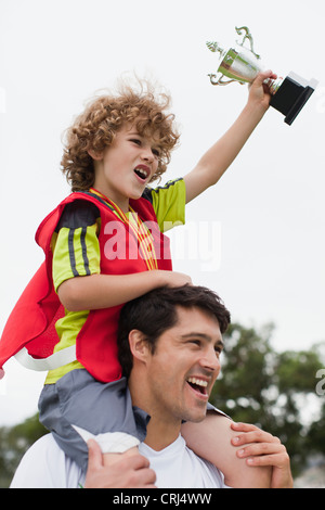 trophy carrying coach child alamy soccer middle team school girl celebrating cheering