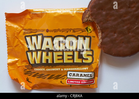 limited edition caramel wagon wheels biscuit with contents removed and bite taken - choccy crunchy & marshmallowy Stock Photo