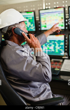 Man working in security control room Stock Photo