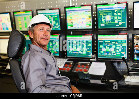 Man working in security control room Stock Photo