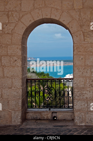 metal fence in a bow from stones on the island Malta Stock Photo