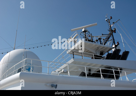 Navigation and communications antennae on cruise ship Island Star Stock Photo