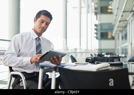 Businessman with tablet computer in cafe Stock Photo