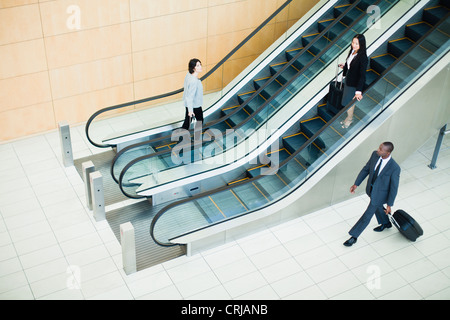 Business people in lobby area Stock Photo