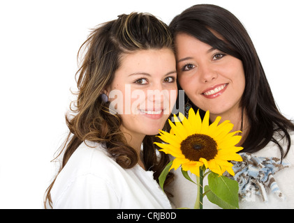 beautiful sisters portrait with a sunflower Stock Photo