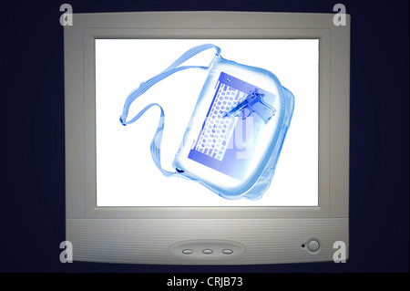 X-ray photograph in a airport of a hand luggage of a terrorist with revolver Stock Photo
