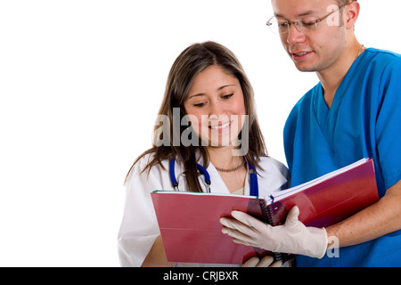 doctor and nurse looking at a notepad Stock Photo
