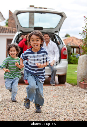 Boy running towards camera on a beach Stock Photo - Alamy