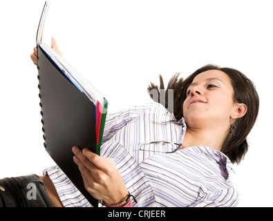 beautiful young student lying on the flor learning Stock Photo