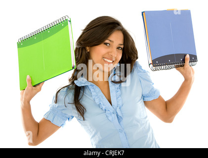 college student smiling and holding notebooks Stock Photo