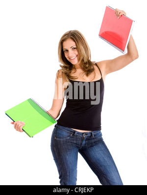 college student smiling and holding notebooks Stock Photo