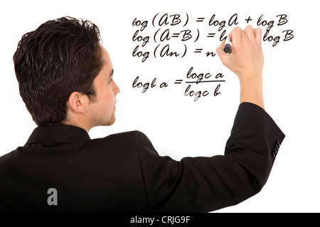 math student writing a formula on the board Stock Photo