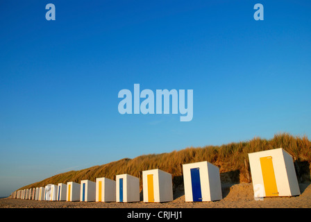 row of beach huts at sandy beach in front of dune, Netherlands, Zeeland, Cadzand Stock Photo