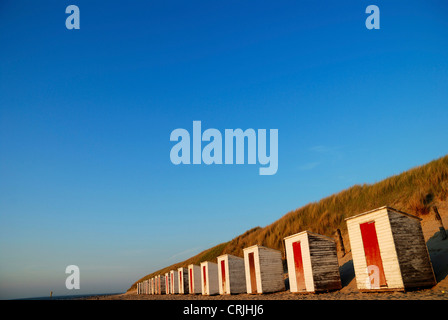row of beach huts at sandy beach in front of dune, Netherlands, Zeeland, Cadzand Stock Photo