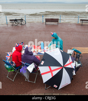 Participants brave stormy weather at the world's largest street party to celebrate the Queen's Diamond Jubilee in Morecambe, UK